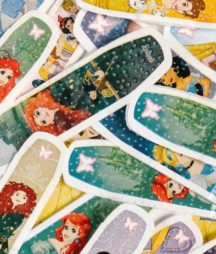 A picture of a pile of Disney princess band-aids